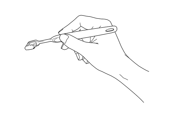 歯ブラシを持っているイラスト